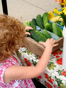 Farmers’ Market Sues City over ‘Pave or Vacate’ Mandate