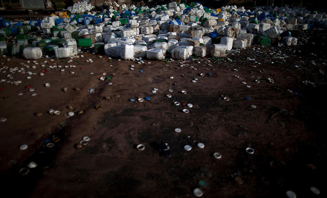 Empty agrochemical containers lay discarded at a recycling center in Quimili, Santiago del Estero province, Argentina, May 2, 2013. CREDIT: Natacha Pisarenko/AP