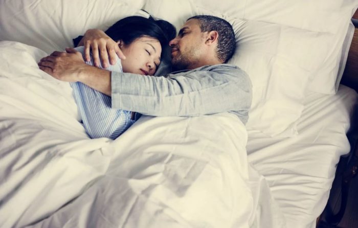 Cuddling Up With Your Partner Can Lead To Better Sleep